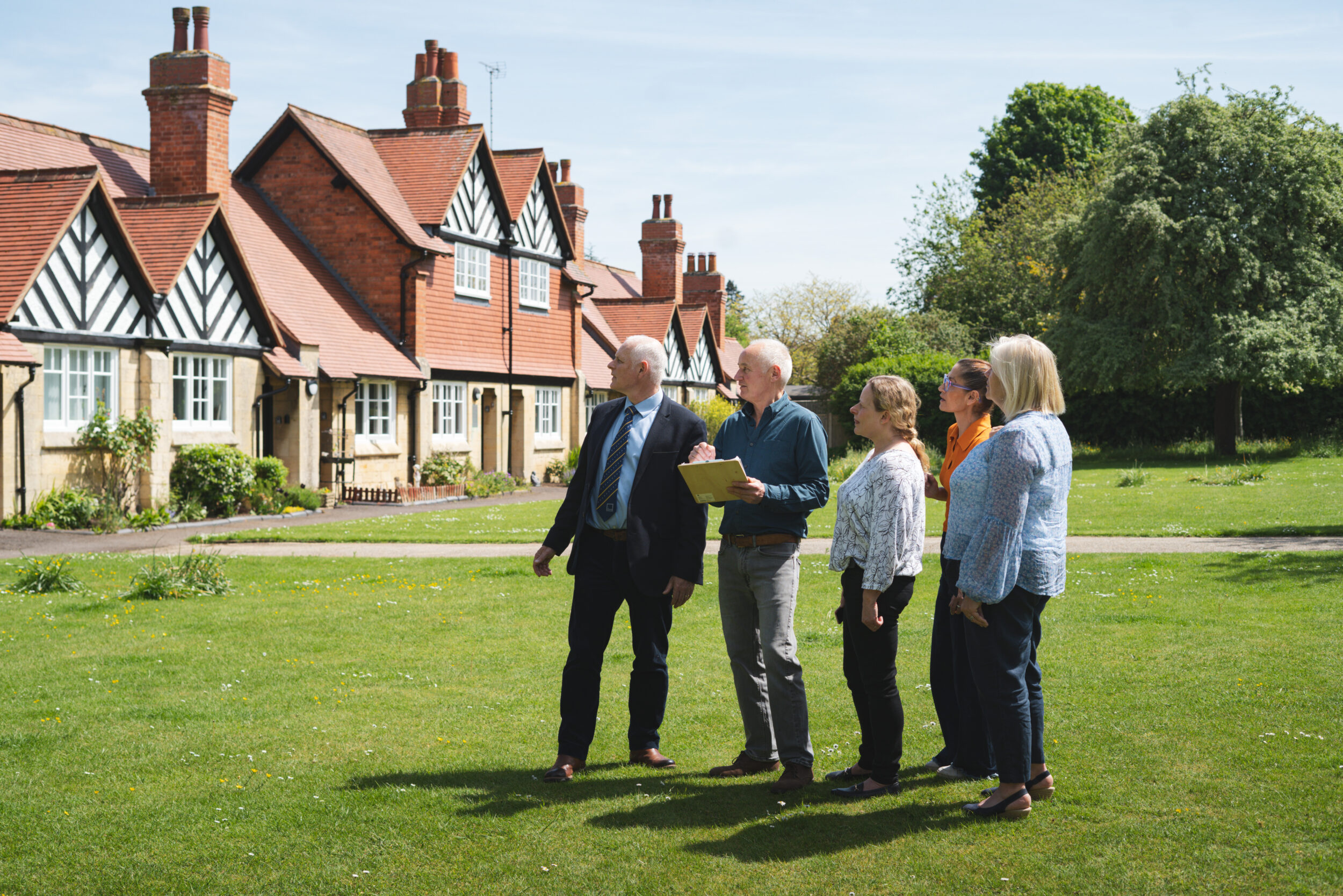 Group looking at the exterior of Hays Cottages in Cheltenham