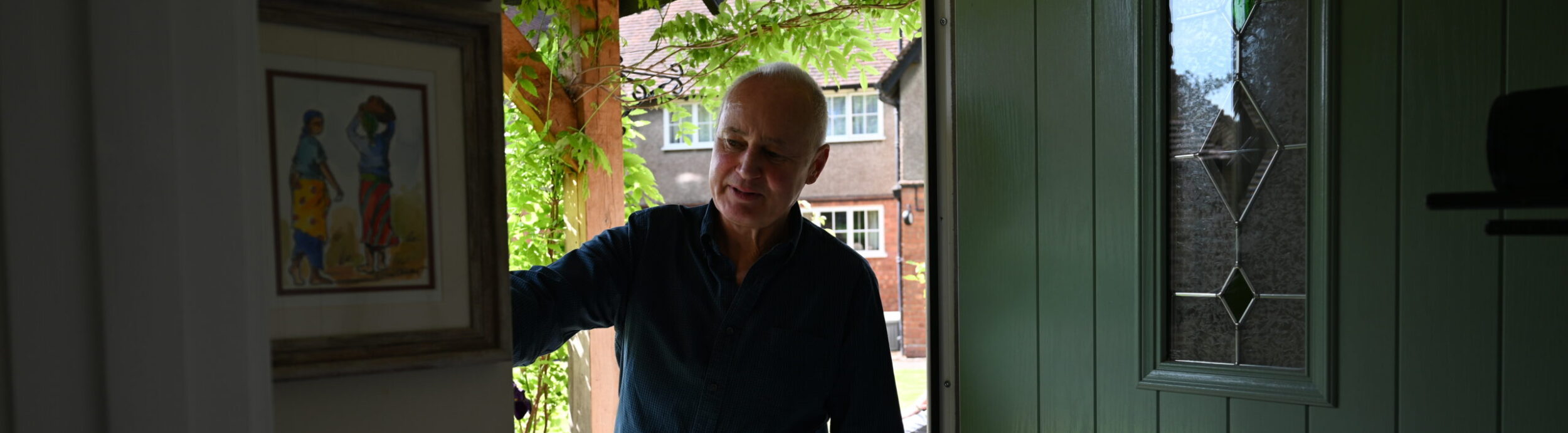 Richard showing the insulation doors at Hays Cottages Almshouses in Cheltenham